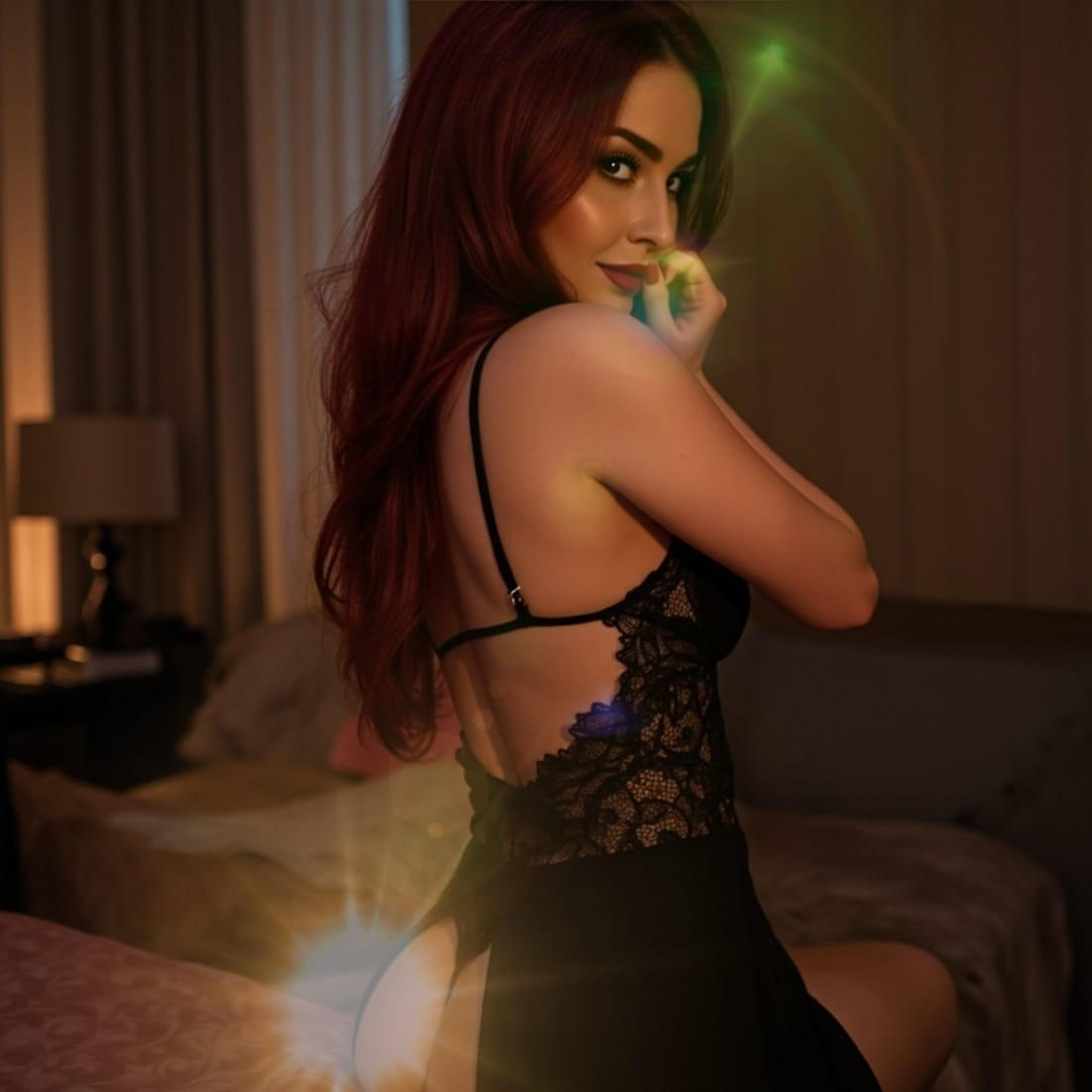 She didn’t wait. She stayed. A red-haired woman wearing black lace lingerie at night, standing in a dim bedroom.